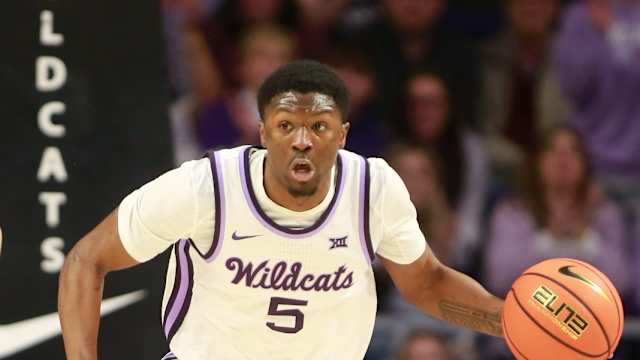 Kansas State junior guard Cam Carter (5) dribbles back a Kansas rebound in the first half of the Sunflower Showdown inside Bramlage Coliseum Monday, February 5, 2024.